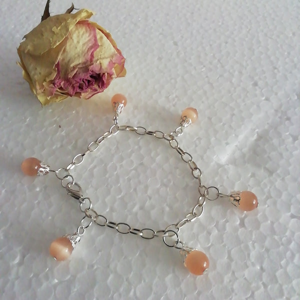 Bracelet avec Six Perles Oranges Oeil de Chat